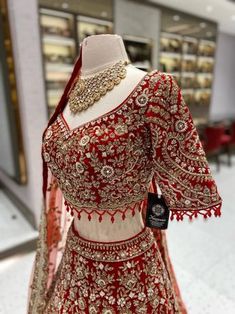 This bright red bridal lehenga BL-134 is the perfect choice for your big day. The intricate detailing of pearls, blush pink and gold stones adds a touch of elegance to the traditional design. Expertly crafted, this lehenga is sure to make you stand out and shine on your special day! Fabric: Velvet! WASH CARE INSTRUCTIONS - Please Dry clean only when it is applicable! Ready to Ship! Designer Semi-stitched Gown With Stone Work, Designer Anarkali Lehenga With Stone Work, Designer Lehenga With Stone Work For Festivals, Fitted Lehenga With Stone Work For Festive Occasions, Elegant Lehenga With Stone Work For Designer Wear, Anarkali Lehenga With Stone Work, Traditional Designer Wear Dupatta With Stone Work, Traditional Dupatta With Stone Work For Designer Wear, Traditional Designer Dupatta With Stone Work