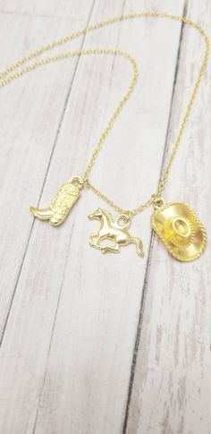 This beautiful Horse Charm Necklace is the perfect gift for someone special!  This makes an excellent gift for yourself or your friends and family members who loves to collect Horse jewelry. Product Details: Material: Gold plated necklace Chain Length: 18 Inches (Can be made in different lengths) Charms: Horse Charm,cowboy hat and cowboy boot. Please reach out to me for customizations.  You can get these personalized necklaces in any length, so please contact me via Etsy Conversations if you nee Girls Necklace, Chapeau Cowboy, Horse Necklace, Horse Jewelry, Beautiful Horse, Horse Gifts, Necklace Chain Lengths, Cowboy Boot, Girls Necklaces