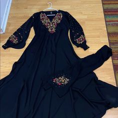 Perfect Condition And Beautiful Material Fitted Long Sleeve Black Abaya, Formal Fitted Black Abaya, Elegant Fitted Black Abaya, Traditional Black V-neck Abaya, Traditional V-neck Black Abaya, Black Long Sleeve Party Abaya, Party Black Long Sleeve Abaya, Black Embroidered Abaya For Evening, Fitted Embroidered Black Abaya