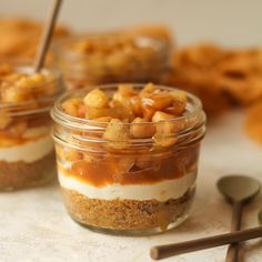 three small jars filled with food on top of a table