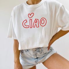 Ciao Shirt for Italy Vacation, Ciao T-Shirt - Hello Italy Italian Tee - Ciao Bella - Unisex Italian Hello Shirt for Rome Trip 🌸 Soft & Lightweight Material - Graphic tees for women are made from a soft, lightweight, and stretchy fabric that provides a familiar and comfortable feel. You'll love wearing it all day long. 🌸 GREAT GIFT: Good choice as a gift for your mom, sister, your wife or anyone you want to send a gift. 🌸 Wash: Recommended machine/hand wash and wash inside out and line dry. PL Casual Summer Tops With Name Print, Trendy Short Sleeve T-shirt With Name Print, Casual White T-shirt With Name Print, Summer T-shirt With Name Print, Relaxed Fit, Summer T-shirt With Name Print In Relaxed Fit, Casual Name Print T-shirt For Summer, Casual Summer T-shirt With Name Print, Graphic Tee With Name Print Short Sleeve, Relaxed Fit Name Print T-shirt For Summer