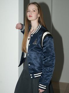 This casual varsity jacket features classic and sporty details like stripe trim, contrasting button and embroidered logo applique. It's finished with lightweight 3 oz filling for adding warmth.- Snap button fastenings- Initial A logo patch at chest - Embroidered logo patch at back- Two front welt pockets- Stripe ribbed trim at neck, cuffs and hem- 3oz filling- Semi-oversized fit - Unisex wear Blue Varsity Outerwear With Letter Patch, Classic Navy Varsity Jacket For College, College Varsity Jacket With Contrast Collar, Varsity Outerwear With Contrast Collar For College, Collegiate Outerwear With Letter Patch And Baseball Collar, Navy Varsity Outerwear With Baseball Collar, Varsity Outerwear With Baseball Collar, Navy Varsity Jacket With Baseball Collar, Collegiate Outerwear With Letter Patch For College