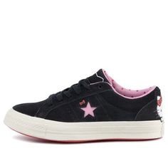 Hello Kitty fans rejoice! The iconic character has teamed up with sneaker giant Converse on the One Star Suede Low Top. The shoe is crafted from premium suede and features a pink star logo with Hello Kitty's bow just above it. Hello Kitty herself makes an appearance on the heel, adding a fun and playful touch. The sneaker comes equipped with Hello Kitty branded laces and a polka dot motif on the sockliner, making it the perfect choice for any Hello Kitty fan. (SNKR/Women's) Hello Kitty Bow, Pink Star, Star Logo, Pink Stars, One Star, Iconic Characters, Low Top, Polka Dot, Converse