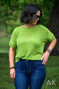 We are loving this bright grass green, short sleeve sweater. It has a soft knit feel with cute ribbed bands on the sleeves, neckline and hem. This fun, bold top is perfect for transitioning from summer to fall! Jessica is wearing a MD. View Model Stats HERE. Knit Roomy Fit 72% Acrylic 28% Nylon Casual Stretch Knit T-shirt, Casual Pointelle Knit T-shirt For Spring, Casual Pointelle Knit T-shirt For Summer, Trendy Green Ribbed T-shirt, Ribbed Stretch Short Sleeve Top For Summer, Casual Stretch Fine Knit Sweater, Summer Relaxed Fit Short Sleeve Top With Ribbed Neckline, Spring Ribbed Stretch Short Sleeve Top, Spring Short Sleeve Top With Ribbed Crew Neck