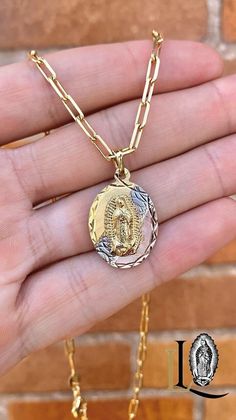 This exquisite Virgen de Guadalupe necklace features a beautifully detailed pendant of the revered Virgin of Guadalupe, a symbol of faith and protection. The pendant is elegantly paired with a sleek Paper Clip chain, known for its modern and minimalistic design. PRODUCT DETAILS * Material: 14K Gold Filled * Metal Purity: 14K * Pendant Size: 26x18mm * Chain Size: 18" Inches * Chain Thickness: 3.5mm * Chain Style: Paper Clip * Gender: Unisex * Age Group: Youth and Adults * Condition: 100% BRAND NE Oval Our Lady Of Guadalupe Necklace For Gift, Oval Our Lady Of Guadalupe Jewelry Gift, Oval Our Lady Of Guadalupe Necklace Gift, Spiritual Oval Necklace Featuring Our Lady Of Guadalupe, Spiritual Oval Our Lady Of Guadalupe Necklace, Guadalupe Necklace, Virgin Of Guadalupe, Our Lady Of Guadalupe, Lady Of Guadalupe