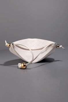 White leather pouch bag with quilting highlighted by gold plated metallic ball embellishments. - Aza Fashions Luxury Pouch Shoulder Bag With Pearl Handle, Luxury Pouch Bag With Pearl Handle, Luxury Crossbody Shoulder Bag With Zipper Pouch, Leather Shoulder Bag With Pearl Handle, Metallic Ball, Leather Pouch Bag, Types Of Work, White Quilt, Quilted Leather