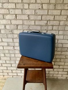 "~ A 1970's Hardshell Suitcase ~ Made by American Touister ~ Model Tiara ~ Royal blue vinyl exterior ~ Working chrome twist latches and handle (NO KEYS) ~ Chrome hinges ~ Four plastic feet ~ Interior blue floral fabric ~ Bag is in excellent used vintage condition (normal usage wear scuffs on exterior) ~ Measurements ~ Approximately 16\" tall x 21\" long x 6 1/2\" wide ~ Bag has endless possibilities ---------------------------------------------------------- Convo for INTERNATIONAL SHIPPING QUOTE Blue Rectangular Briefcase With Luggage Sleeve, Classic Blue Rectangular Case, Classic Blue Rectangular Cases, Vintage Blue School Bag, Hardshell Suitcase, Tiara Royal, Suitcase Vintage, Mid Century Blue, Blue Floral Fabric