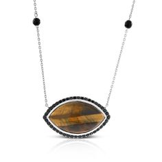 Large unique shape golden brown tigers eye gemstone mimics the 'cat's eye' name given to the gems natural banding. Surrounded by black sapphires and accented with black onyx beads, this piece is fashion forward and can be worn for any occasion. Shortening loop at 16.5 inches allows versatile wear at shorter length. Pair up with ring 11430543 to complete your look.  Part of the Cascades Collection by Lisa Bridge, this piece evokes the raw natural beauty of the mountain range and invites untamed a Lose A Stone, The Cascades, Brown Tiger Eye, Brown Gemstone, Black Sapphire, Tigers Eye Gemstone, Shortening, Onyx Bead, Sapphire Necklace