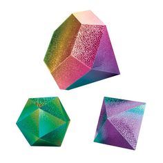 three different colored crystals on a white background, one is green and the other is pink