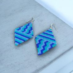 ✦ Made with High Quality Miyuki Seed Beads ✦ Sterling Silver Ear Wires ✦ About 2 inches long ✦ Made with love in California 🌊 Blue Bohemian Triangle Earrings, Bohemian Blue Triangle Earrings, Handmade Blue Geometric Earrings, Blue Bohemian Jewelry With Geometric Shape, Bohemian Blue Geometric Earrings, Blue Bohemian Geometric Jewelry, Bohemian Blue Geometric Jewelry, Handmade Blue Geometric Jewelry, Brick Stitch Pattern