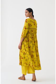 Radiate sunshine vibes with this flori yellow k-1 kurta and pants set. Vibrant and chic, this ensemble is perfect for adding a pop of color to your wardrobe. Crafted with comfort and style in mind, it's your go-to choice for effortless elegance.