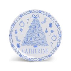 a blue and white plate with a christmas tree on it