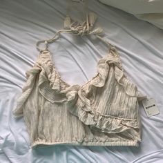 Super Cute Free People Beach Top! Ivory Color With Ruffles. New With Tags And Size Small Beige Sleeveless Top For Beach Season, Spring White Halter Top With Ruffles, White Ruffle Halter Top For Spring, White Ruffled Halter Top For Spring, Casual Spring Halter Top With Ruffles, White Ruffled Halter Top For Summer, Beige Sleeveless Crop Top For Beach Season, Summer Ruffles Halter Top, Chic Ruffled Halter Top For Vacation