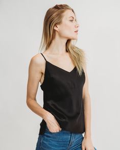 Our Worry-Free Silk Cami has all the makings of your next wardrobe staple, thanks to a comfortable fit, machine-washable fabric, and elegant silhouette. Built-in bra cups mean that you will never have to deal with unsightly bra straps or uncomfortable strapless bras and adhesives. Adjustable shoulder straps ensure you get adequate support and a perfect fit. Model is wearing a size XS. Black Silk Top, Silk Cami Top, Strapless Bras, Black Cami Top, Model Poses Photography, Silk Cami, Silk Slip Dress, Silk Charmeuse, Silk Slip