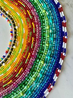 multicolored beaded bracelets arranged in a circle