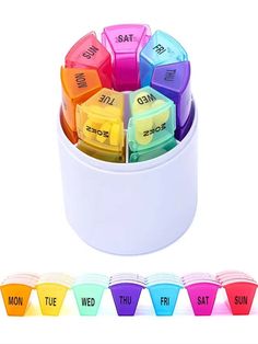 a white container filled with lots of different colored dices next to eachother