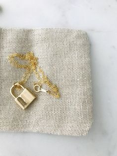 "Padlock Necklace * 14k gold filled Beautiful padlock necklace! The pendant is made of thick 18k gold filled. Great quality and fun to layer with other necklaces. d e t a i l s -- 14k gold filled chain -- 14k gold filled spring clasp closure -- 18k gold filled padlock measure 20MM * model is wearing 18\" Necklace comes in a kraft jewelry box with a bow on top h o w * t o * o r d e r 1. please select options from the dropdown menu 2. add to cart and proceed to checkout 3. then place your order g Gold Necklace For Everyday Use, Personalized Gold Jewelry For Everyday Use, 14k Gold Necklace With Gold Clasp For Gift, Gold Lock Necklace As Gift, Everyday Gold Lock Jewelry, Everyday Gold Jewelry With Lock Detail, Yellow Gold Necklace With Lock As Gift, Necklace Lock, Padlock Necklace