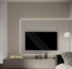 a living room with a large flat screen tv mounted to the side of a wall