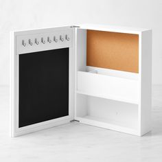 Whether you're coming or going, our exclusive organizer keeps all your essentials in one place. The wooden cabinet has a mirror outside and a plethora of storage inside. It's equipped with compartments for phones and mail, cork and magnetic boards for cards and messages, and hooks for keys and badges. Multifunctional organizer features mirror, corkboard, magnetic board, 3 compartments and 8 hooks. Made of durable engineered wood with white-painted finish and metal hardware. Comes with hanging hardware and mounting instructions. A Williams Sonoma exclusive. Kitchen Wall Family Organizer, Mail Storage Ideas, Key Box Holder, Entry Organizer, Summer Cocktail Menu, Mirror Outside, Entry Organization, College Kitchen, Registry Essentials