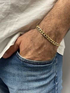 ➣ High quality 14K Yellow Gold Lite Curb Chain with Lobster Lock, 6.2mm Wide, Real Gold Bracelet, Unisex, Men ➣ MATERIAL: 14K Yellow Gold  ➣ Closure: Lobster   ➣ Weight: 4.80g ◈ Please note that weights are approximate. ➣ If you need a specific length, please message us. ➣ SHIPPING: ◈ We always offer domestic FREE SHIPPING via USPS first class (3-5 business days)  ◈ We ship internationally, shipping costs are shown at checkout.     Please be aware that the buyer is responsible for any international customs & duties. ◈ Orders shipped from NYC usually within 24-48 hours from receiving payment.   ◈ All orders are packaged in a gift box at no additional cost. ➣ Return / Exchange policy: ◈ Your satisfaction is important to us! Send back the item in the same condition as received.     Get a full Real Gold Bracelet, Gold Vermeil Jewelry, Yellow Gold Bracelet, Pure Gold, Curb Chain, Chain Link Bracelet, Real Gold, Gold Vermeil, Arm Band