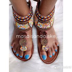 100% handmade using leather and fine beads. Masai beaded sandals are made using the pure original leather and quality African beads.They are inspired by the Masai community They are perfect for any occasion. True to size. We ship worldwide. Feel free to send me a convo for any clarifications Adjustable Toe Ring Sandals With Open Heel For Beach, Bohemian Embellished Beach Sandals, Bohemian Embellished Sandals For The Beach, Embellished Toe Post Sandals For Festival, Embellished Toe Post Festival Sandals, Bohemian Embellished Sandals For Summer, Summer Bohemian Embellished Sandals, Summer Beaded T-strap Sandals With Open Toe, Beaded Toe Loop Sandals For Summer