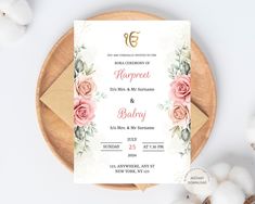 a wedding card with flowers on it next to cotton