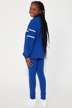 Available In Royal. Legging Set T-Shirt Long Sleeve V-Neck Graphic Leggings Elastic Waistband Stretch XS= (4/5) S= (6/6x) M =(7/8) L =(10/12) XL =(14/16) Model Wears Size L Mommy & Me Takedown Of "Stadium Babe Legging Set" 95%Cotton, 5% Spandex Imported | Mini Stadium Babe Legging Set in Royal size 7/8 by Fashion Nova Graphic Leggings, 5 S, Royal Fashion, Mommy And Me, Fashion Nova, Long Sleeve Shirts, Size 4, Size 10, Size 7