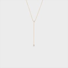 This dainty and sophisticated piece is the perfect addition to any collection! Fine Jewelry Drop Necklace With Single Diamond, Classic Drop Necklace With Single Diamond, Briolette Diamond Necklace With Delicate Chain, Adjustable Yellow Gold Necklace With Diamond Accents, Minimalist Teardrop Necklace With Single Diamond, Delicate Briolette Diamond Necklace, Formal Drop Necklace With Single Diamond, Elegant 14k Gold Diamond Necklace With Teardrop Pendant, White 14k Gold Diamond Necklace With Clavicle Chain