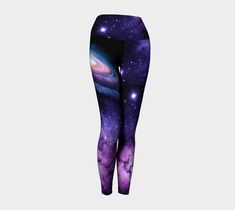 a woman's leggings with an image of the galactic sky and stars