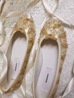 Champagne/Gold flat shoes I meticulously designed these beautiful shoes fit for a real princess on her wedding day I hand dyed and hand embellished them, these are not found in stores I used beautiful first class elements: gold Venice lace trim, silver Swarovski crystals, glass pearls, reversible ribbon. US Adult Sizes: 5, 5.5, 6, 6.5, 7, 7.5, 8, 8.5, 9, 9.5, 10, *11 & *12 and W Wide width from 6W - 10W, *11W, *12W *Size 11 & 12, Wide or Regular width are an extra $15.00. Please contact Closed Toe Wedding Shoes With Satin Bow, Pearl Embellished Closed Toe Wedding Shoes For Ceremony, Pearl Embellished Closed Toe Wedding Shoes, Elegant Wedding Shoes With Laces For Ceremony, Elegant Closed Toe Wedding Shoes With Laces, Elegant Laced Wedding Shoes For Ceremony, Elegant Lace Wedding Shoes For Ceremony, Wedding Shoes With Round Toe For Ceremony, Cream Round Toe Wedding Shoes