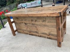 an outdoor bar made out of wooden planks