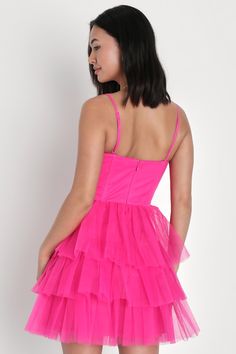 Treat any event like your own personal fashion show when you're wearing a show-stopping look like the Lulus Rule the Runway Hot Pink Tulle Bustier Tiered Mini Dress! This stunning dress is composed of sheer mesh tulle (atop a stretch knit lining) that shapes an alluring bustier-inspired bodice with seamed cups and supportive boning, a sweetheart neckline, and adjustable spaghetti straps. The high, fitted waist tops an A-line mini skirt, adorned with fluffy tiers of tulle that are sure to make you look ""tulle-y"" mesmerizing as you dance the night away! Hidden back zipper/clasp. Fit: This garment fits true to size. Length: Mid-thigh. Size medium measures 32.5" from top to bottom. Bust: Great for any cup size. Waist: Fitted - very fitted at natural waist. Hip: Not Fitted - room for hips. Un Tulle Tiered Dress, Hot Pink Mini Dress, Pink Homecoming Dress, Tiered Mini Dress, Lulu Fashion, Dress Tulle, A Line Mini Skirt, Bustier Dress, Pink Tulle