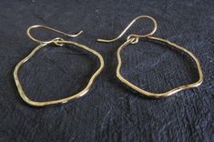 "Artisan handmade organic shape earrings. These are available in sterling silver with a couple of different finish options as well as the pictured 14k gold filled. The Details. ∞ Artisan handmade ∞ 14k gold filled or sterling silver textured drops (approx 1 1/2\" long, 1\" wide) ∞ 14k gold filled or sterling silver handmade ear hooks ∞ Approximate total length ~ 2\" ∞ Made to order Θ Allow up to 14 business days before shipment Θ ∞ Gift box included ∞ Made in the USA VISIT OUR SHOP: http://www.P Hammered Freeform Jewelry As A Gift, Hammered Freeform Jewelry For Gifts, Artisan Hammered Jewelry In Recycled Gold, Artisan Hammered Recycled Gold Jewelry, Prescott Az, Handmade Artisan, Earrings Handmade, Handmade Silver, Gold Filled