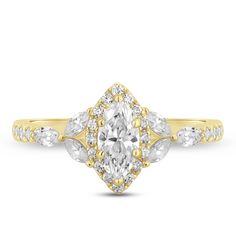 a yellow gold engagement ring with an oval cut diamond and pear shaped diamonds on the band