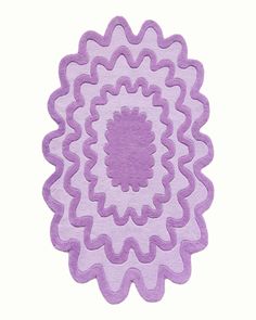 a purple rug with an intricate design in the center on a white background, it appears to be made from felt