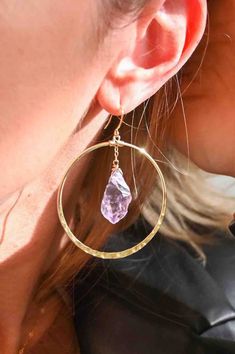 Gorgeous goddess hoops right here. These raw Amethyst crystals are suspended in the center of a hammered hoop and not only look luxurious, but make you feel it too. Wear these and remember you are a goddess.  Amethyst is the stone of your Highest Self, asking you to listen to your intuition as she always knows the truth. ▲ 2" gold plated hammered hoops ▲ Raw Amethyst crystals  ▲ Weight: 1/8 oz  ▲ Handmade in Arizona Love hoop earrings as much as we do?  Shop them all here!  https://etsy.me/3txKb Purple Amethyst Hoop Jewelry, Purple Hoop Jewelry For Gift, Purple Gemstone Hoop Earrings, Purple Hoop Jewelry, Listen To Your Intuition, Raw Amethyst Crystal, Highest Self, Tarnished Jewelry, Amethyst Gold