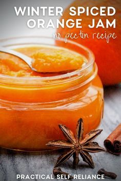 an orange jam in a jar with cinnamon and star anise