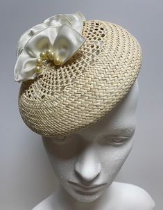 When you buy a Fascinator made from Toquilla Straw, you don't just buy a Fascinator, you buy a piece of art. This genuine Panama hat is woven in Ecuador by Ecuadorian Artisans. Colour & Dimensions: ---------------------- Classic Design: Lili Shape: Blocked using the Large wooden block Colour: Beige Crown: 20cm Height: 3.5 cm Silk flowers  high quality crystal pearls Elastic band inside  It is made from 100% toquilla straw, the same fiber used to make the very famous Panama Hat.   Be aware this h Elegant Hat With Structured Crown In Natural Color, Elegant Natural Hat With Structured Crown, Cream Adjustable Fascinator For Spring, Spring Cream Adjustable Fascinator, Beige Adjustable Fascinator For Garden Party, Adjustable Beige Fascinator For Garden Party, Adjustable Woven Hat With Structured Crown, Elegant Adjustable Woven Straw Hat, Elegant Natural Handwoven Hat