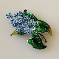 Unique vintage style plant flower brooch In enamel on metal . Please see photos for the actual item listed. Thank you for viewing our item Green Flower-shaped Enamel Brooch Pin, Green Flower Shaped Enamel Pin Brooch, Green Flower Enamel Pin Brooch, Vintage Enamel Flower Brooches, Flower Shaped Enamel Brooch Pin, Flower Shaped Enamel Brooch, Floral Enamel Brooch Pin, Vintage Flower Enamel Pin, Vintage Flower Enamel Pin Gift