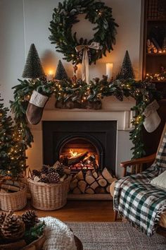 a living room decorated for christmas with stockings and wreaths on the fireplace mantel