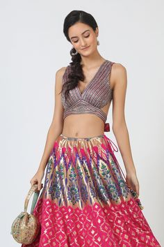 Pink lehenga with floral brocade motifs and side tassel tie-up. Comes with embroidered blouse and dupatta.
Component: 3
Embroidered
Neckine: V neck
Sleeve Length: Sleeveless
Color: Pink
Floral motifs
Back cutout and tie-up
Note: Bag shown in the image is not for sale - Aza Fashions Multicolor Lehenga With Unstitched Blouse For Celebration, Celebration Multicolor Lehenga With Unstitched Blouse, Celebration Lehenga With Unstitched Blouse In Multicolor, Navratri Celebration Lehenga With Tilla Detailing, Reception Saree-shape Choli In Brocade, Brocade Saree Choli For Reception, Reception Saree-shaped Brocade Choli, Brocade Choli For Reception Shaped Like Saree, Brocade Choli For Reception