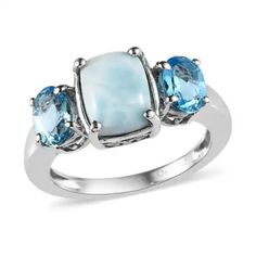 Larimar Cushion Cut 1.74 Pts 2 Swiss Blue Topaz Oval 1.10 Pts. Makes This 3 Stone Ring Elegant And Stylish. 2.84 Ctw Platinum O/Sterling Silver Beautiful Larimar Comes From Hispaniola In The Caribbean Elegant Blue Larimar Rings, Blue Aquamarine Three Stone Jewelry, Elegant Larimar Rings For Anniversary, Wedding Rings Princess Cut, 3 Stone Ring, Black Wedding Rings, Ring Elegant, Beautiful Wedding Rings, 3 Stone Rings