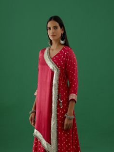 Pink Modal satun bhandhej anarkali kurta comes with jacket and ghungroo detailing on the yoke, a round neck with tie-up, and quarter sleeves. The kurta comes with maroon satin lycra pants. Fabric: Modal Satin and Lycra Color: Pink Note: Available in other colors The product will be delivered within 20-25 days of the order placed Wash care - Dry clean only Size Measurements: XS S M L XL 2XL Waist 24 26 28 30 32 34 Bust 32 34 36 38 40 42 Hips 34 36 38 40 42 44 Bandhani Pattern, Anarkali Kurta Set, Satin Hands, Pant For Women, 5 Elements, Anarkali Kurta, Pants Fabric, Satin Color, Kurta Set