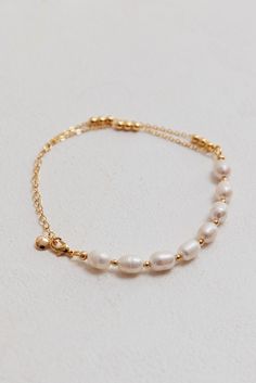 Polaris Freshwater Pearl Double Chain Bracelet Gold by Selfie Leslie Gold-plated Pearl Chain Bracelet, Gold Pearl Charm Chain Bracelet, Gold Plated Pearl Chain Bracelet, Gold Pearl Bracelet With Oyster Detail, Delicate Gold Chain Bracelet With Pearl Charm, Gold Pearl Bracelets With Adjustable Chain, Gold Plated Chain Bracelet With Pearl Charm, Gold Pearl Chain Bracelet With Adjustable Chain, Adjustable Chain Pearl Bracelet