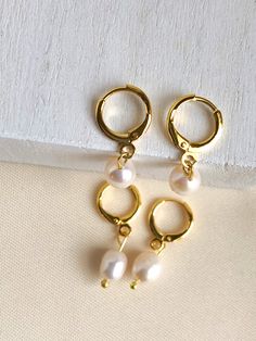 These earrings are gold plated. Everyday Hypoallergenic Metal Clip-on Earrings, Gold Pearl Drop Cartilage Earrings As Gift, Elegant Hypoallergenic Metal Clip-on Earrings, Gold Pearl Drop Cartilage Earrings, Everyday Round Hypoallergenic Pearl Earrings, Everyday Hypoallergenic Round Pearl Earrings, Nickel-free Small Hoop Earrings For Wedding, Classic Nickel-free Huggie Earrings, Nickel-free Dainty Huggie Earrings