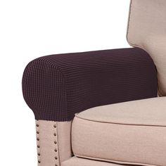 an upholstered chair with buttons on the armrests and back rest area