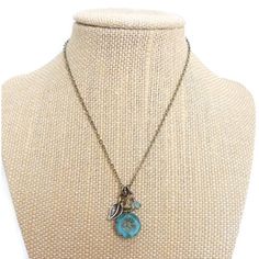 Brand New, Still In Box! Romantic Charm Necklace With An Aqua Blue Hawaiian Flower Bead That Is Delicately Carved In The Center Surrounded By A Small Antiqued Bronze Etched Leaf And An Opaque Off-White Bead. All Of The Charms Are Suspended On A Bronze Chain And Finished With A Lobster Clasp. Charm Cluster Is 1.25" (3 Cm) Long. Chain Is 25" Long (12.5" Drop). Handmade By An Artist Out Of New Jersey! Blue Bohemian Necklace With Flower Charm, Bohemian Charm Necklace With Flower Pendant For Gift, Bohemian Flower Pendant Charm Necklace As Gift, Blue Nickel-free Charm Necklaces For Jewelry Making, Blue Bohemian Nickel-free Necklaces, Nickel-free Blue Bohemian Necklaces, Bohemian Flower Charm Necklace For Gifts, Vintage Charm Blue Jewelry For Jewelry Making, Turquoise Necklace With Vintage Charm For Gift