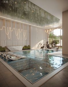 an indoor swimming pool in a large room