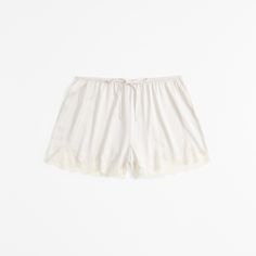 Indulge in the luxurious comfort of Abercrombie & Fitch's Lace and Satin Sleep Shorts, designed to enhance your nighttime routine. These elegant shorts combine the silky smoothness of satin with the delicate allure of lace, making them a must-have in your sleepwear collection.

- **Size**: Medium
- **Color**: Cream
- **Material**: Body - Polyester, Elastane; Lace Detail
- **Gender**: Female
- **Age Group**: Adult

Crafted with an elasticated drawstring waistband, these shorts offer a perfect fit Feminine Cotton Pajama Shorts, Summer Pajama Shorts With Lace Trim, Spring Lace Trim Pajama Shorts, Lace Trim Pajama Shorts For Spring, Cotton Pajama Shorts With Lace Trim For Spring, Summer Lace Trim Loungewear Shorts, Spring Loungewear Shorts With Lace Trim, Relaxed Fit Lace Trim Sleepwear For Loungewear, Spring Lounge Shorts With Lace Trim