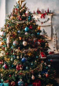 a decorated christmas tree with presents under it